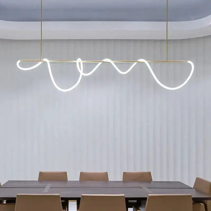 Modern gold curved LED pendant chandelier with wavy light over dining table on Tampa Home & Garden Store