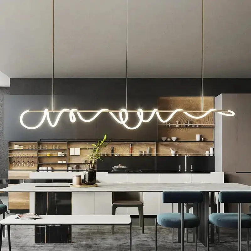 Decorbites modern gold curved LED chandelier pendant light for dining room over island on Tampa Home & Garden Store