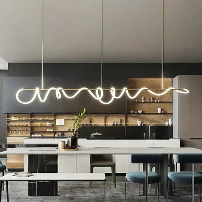 Decorbites modern gold curved LED chandelier pendant light for dining room over island on Tampa Home & Garden Store