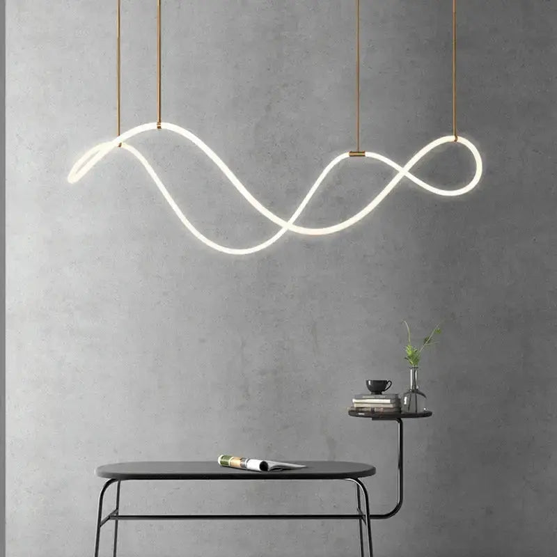 Modern gold curved LED chandelier pendant light by Decorbites with looping wave on Tampa Home & Garden Store