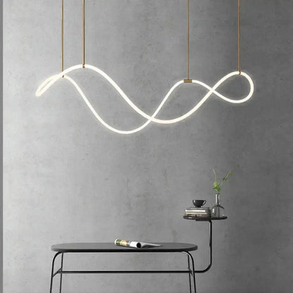 Modern gold curved LED chandelier pendant light by Decorbites with looping wave on Tampa Home & Garden Store