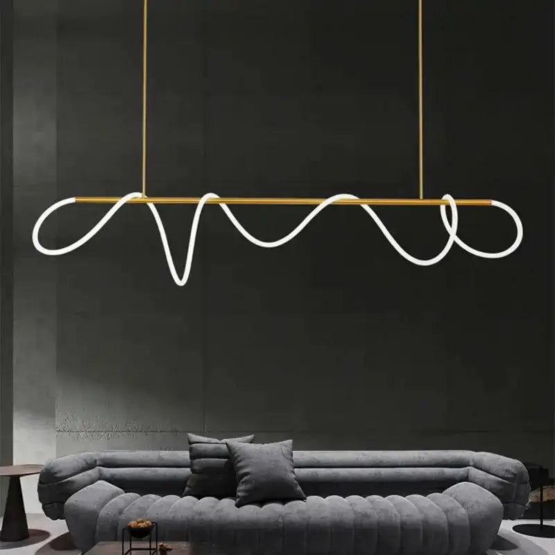 Decorbites modern gold curved LED chandelier pendant for dining room with looping tubes on Tampa Home & Garden Store