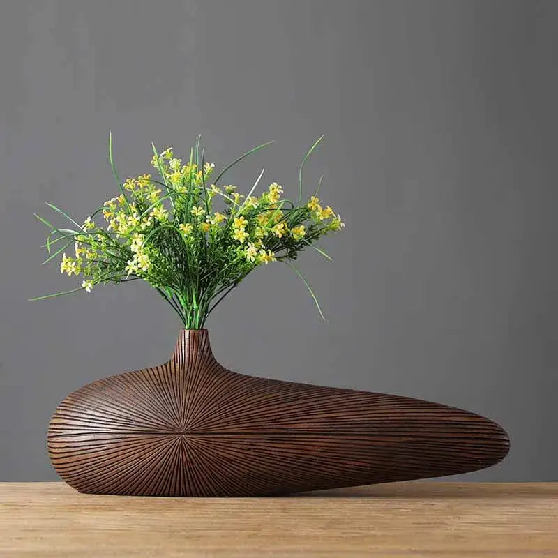 Light brown resin vase Decorbites with sunburst radial texture and bulbous base on Tampa Home & Garden Store