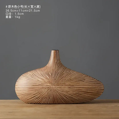 Light brown resin vase by Decorbites ribbed sunburst texture wide oval body with slim neck on Tampa Home & Garden Store