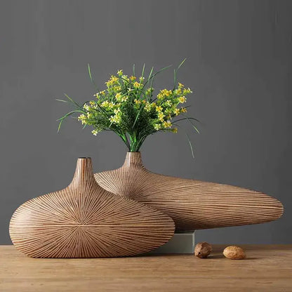 Light brown resin vases pair with radial texture by Decorbites on Tampa Home & Garden Store