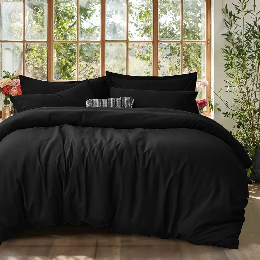 Black Satin Duvet Set by Decorbites on bed with satin duvet and shams, textured pillow on Tampa Home & Garden Store