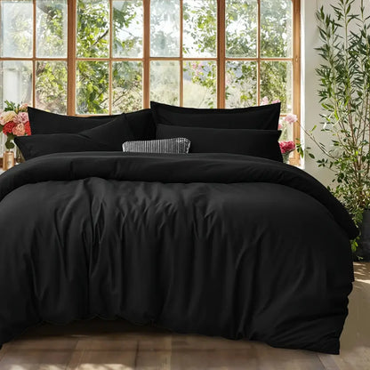 Black Satin Duvet Set by Decorbites on bed with satin duvet and shams, textured pillow on Tampa Home & Garden Store