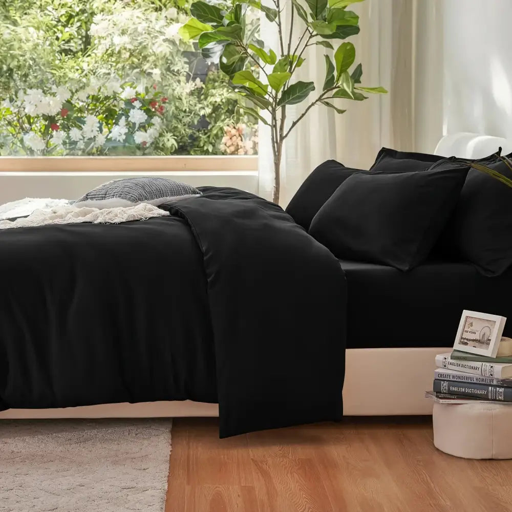 Black Satin Duvet Set by Decorbites, black satin duvet with matching pillow shams on a bed on Tampa Home & Garden Store