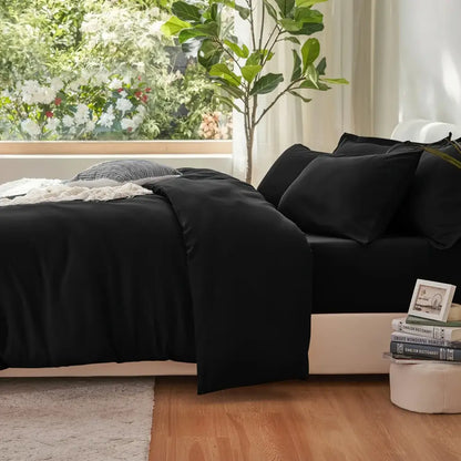 Black Satin Duvet Set by Decorbites, black satin duvet with matching pillow shams on a bed on Tampa Home & Garden Store