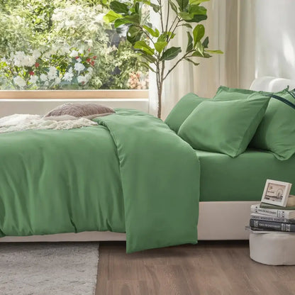 Green satin duvet cover set with matching pillows on Tampa Home & Garden Store