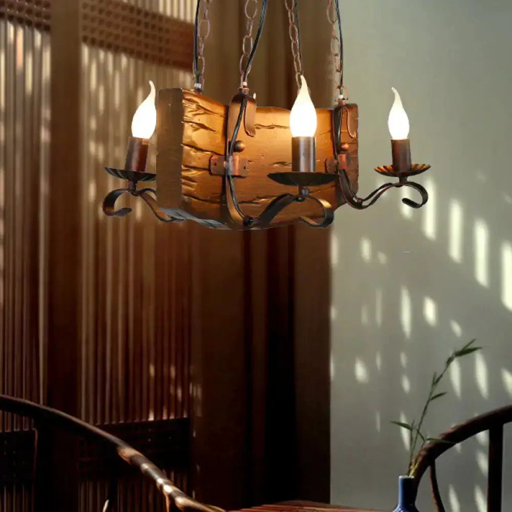 Rustic bronze island chandelier with log-textured centerpiece and three candle bulbs chain-hung on Tampa Home & Garden Store