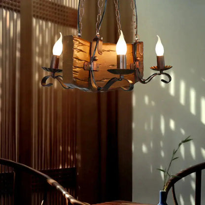 Rustic bronze island chandelier with log-textured centerpiece and three candle bulbs chain-hung on Tampa Home & Garden Store