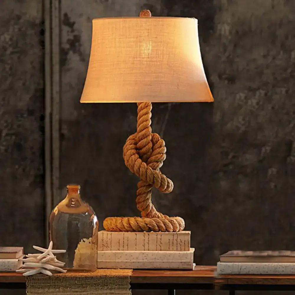 Rope Table Lamp Decorbites with beige fabric shade and twisted jute rope base atop stacked books on Tampa Home & Garden Store