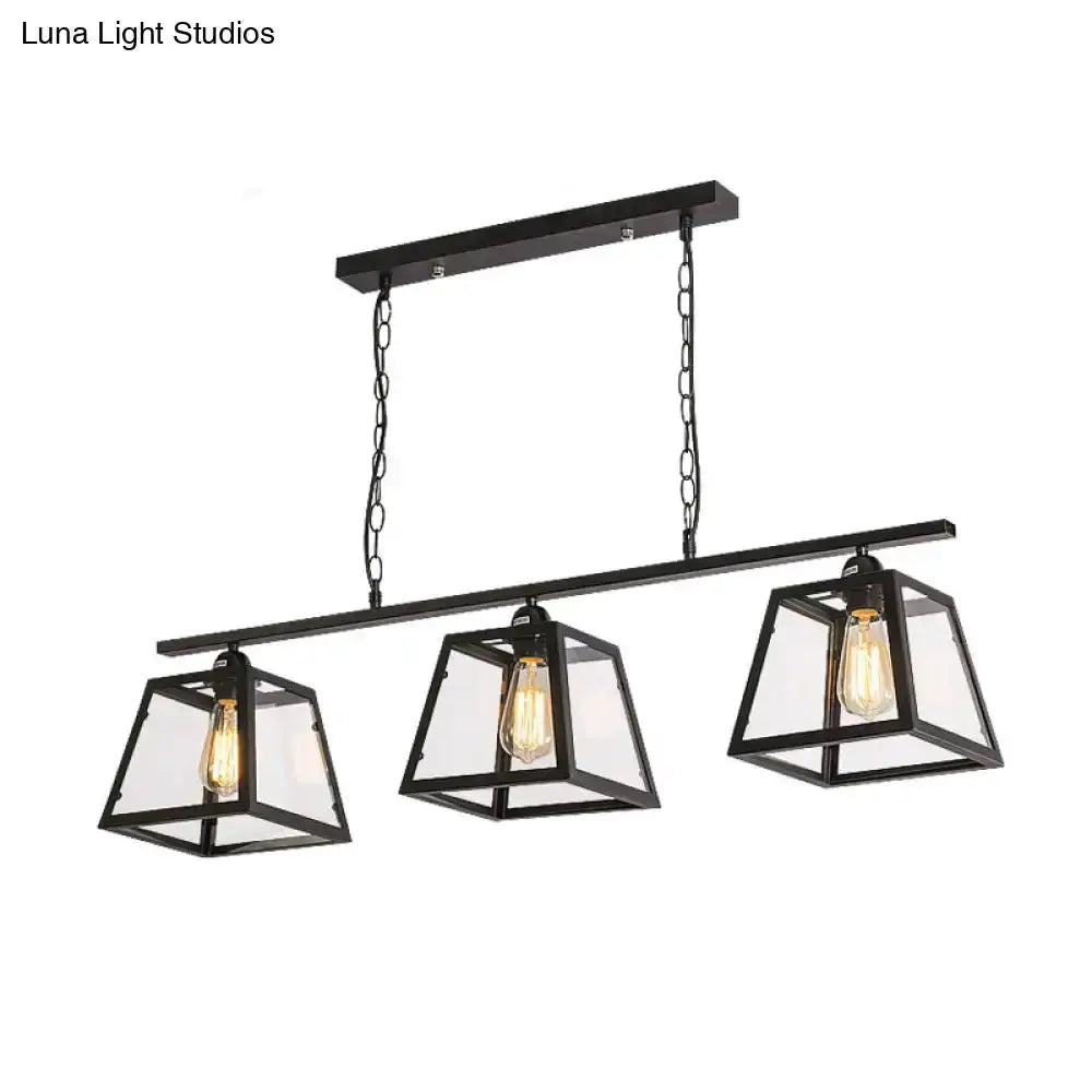 Industrial black metal island pendant light Decorbites with three glass lanterns on Tampa Home & Garden Store