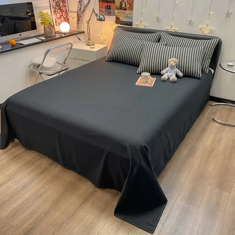 Nordic plaid muted green duvet cover by Decorbites on bed with striped gray pillows on Tampa Home & Garden Store