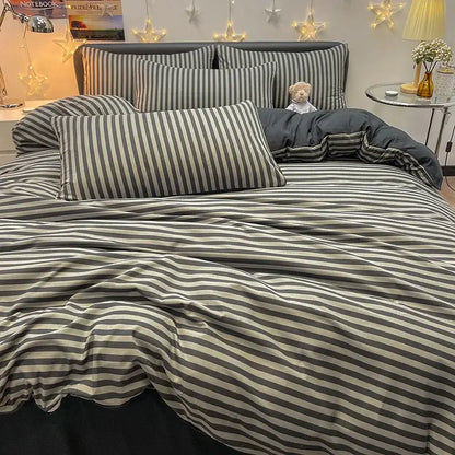 Duvet cover bedding set with gray and white stripes and coordinating pillow shams on bed on Tampa Home & Garden Store