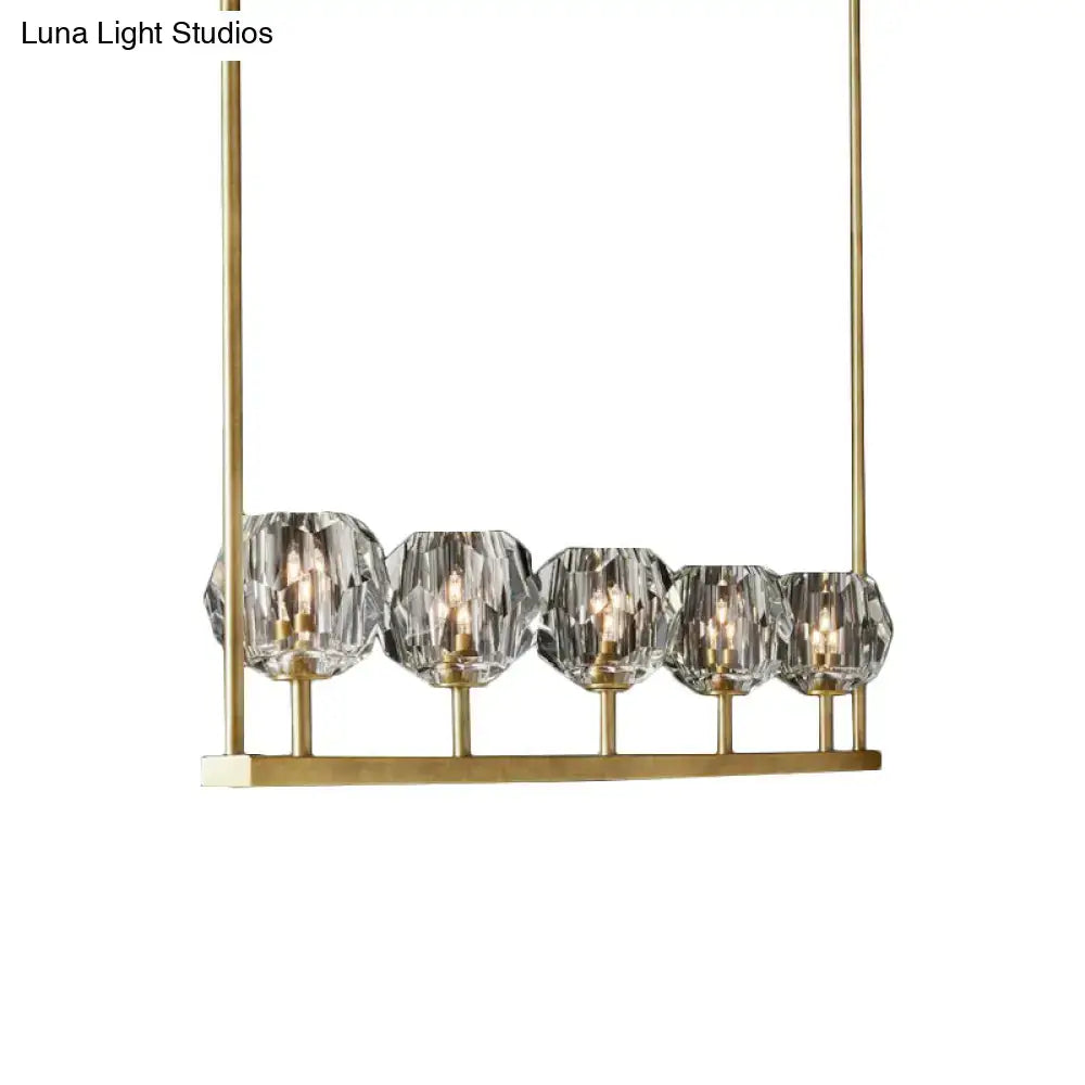 Premium brass crystal island chandelier with five faceted crystal globes on a brass bar on Tampa Home & Garden Store