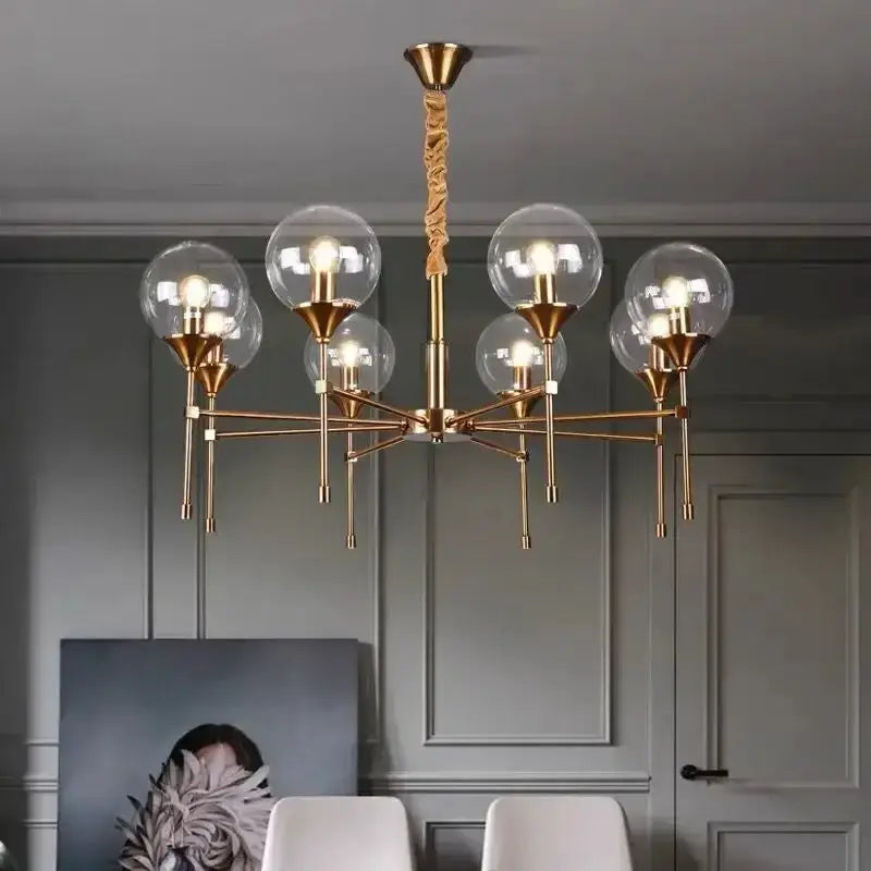 Chandelier modern brass Decorbites multi-arm fixture with smoked glass globes on Tampa Home & Garden Store