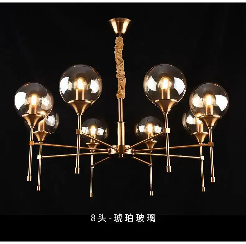 Chandelier Decorbites modern brass fixture with eight smoked glass globes on Tampa Home & Garden Store