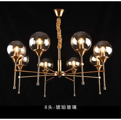 Chandelier Decorbites modern brass fixture with eight smoked glass globes on Tampa Home & Garden Store