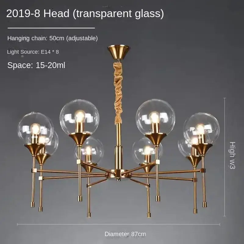 Modern brass chandelier with eight smoked glass globes and brass arms by Decorbites on Tampa Home & Garden Store