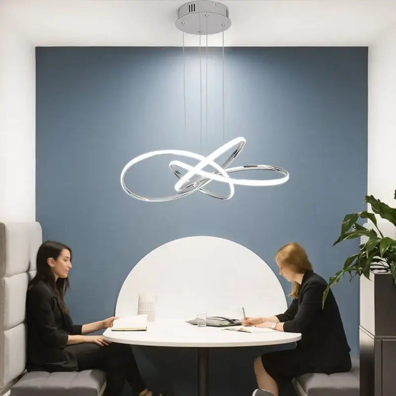 Gold Ring Chandelier dimmable Decorbites LED rings over round white table in meeting space on Tampa Home & Garden Store