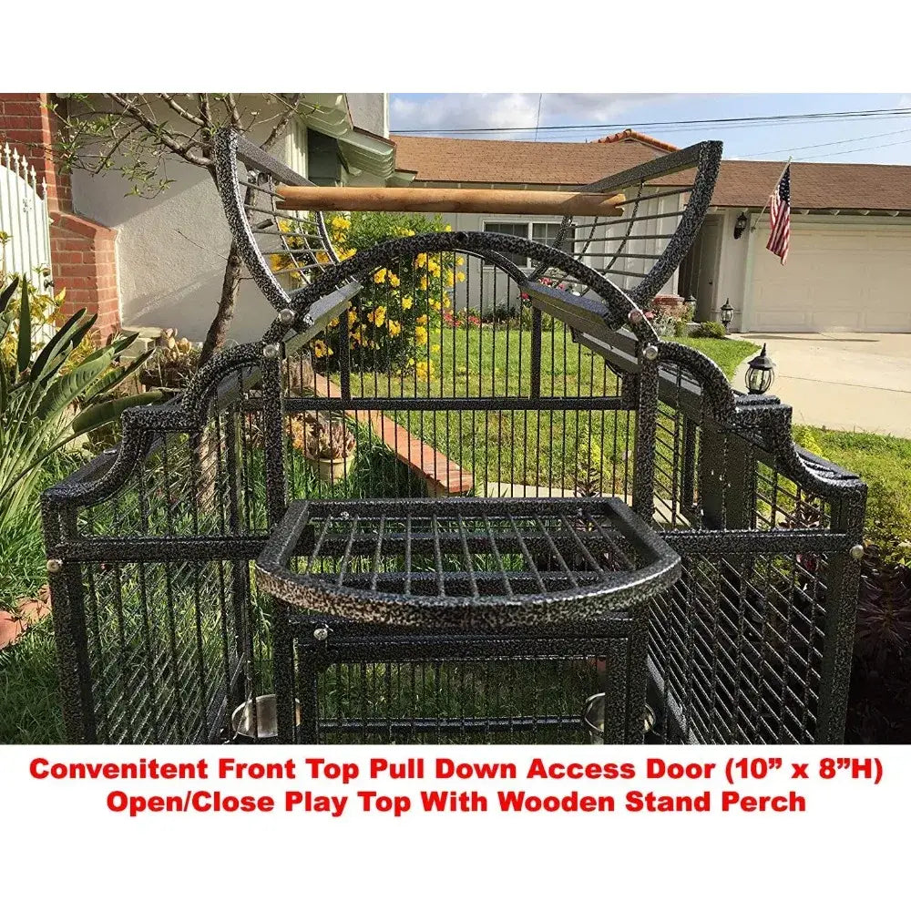 Black wrought-iron bird cage with ornate arch top, front pull-down door, and wooden perch on Tampa Home & Garden Store