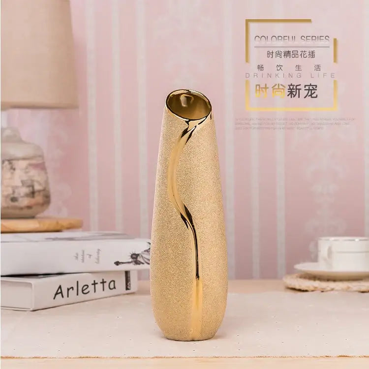 Gold cream ceramic vase by Decorbites with textured gold finish and curved metallic accent on Tampa Home & Garden Store