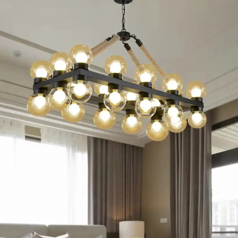 Industrial farmhouse black pendant with cognac glass bulbs over dining room setting on Tampa Home & Garden Store