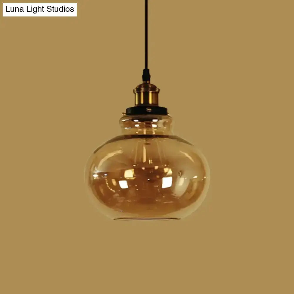 Farmhouse brass pendant light with amber glass globe, Decorbites kitchen hanging light on Tampa Home & Garden Store