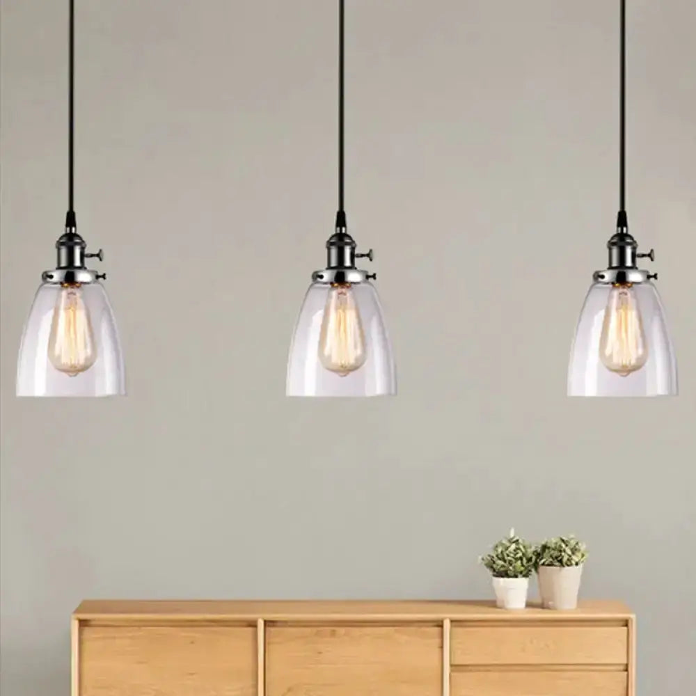 Farmhouse black 3-light clear glass pendant lights with metal hardware over a sideboard on Tampa Home & Garden Store