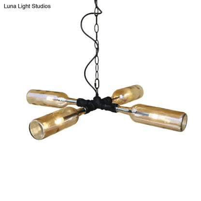 Farmhouse chandelier with four amber glass bottle shades on a black metal hub on Tampa Home & Garden Store