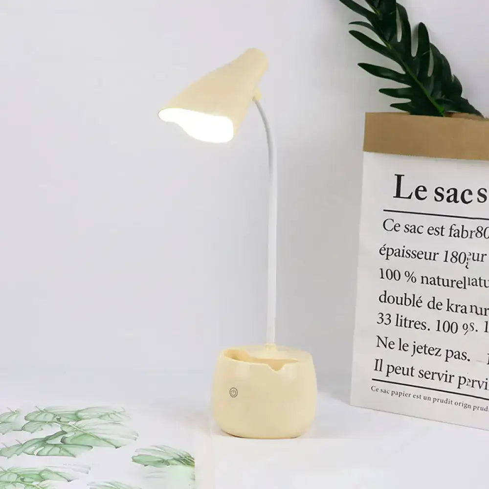 Cream LED Desk Lamp by Decorbites with curved white stem and cream shade and ceramic base on Tampa Home & Garden Store