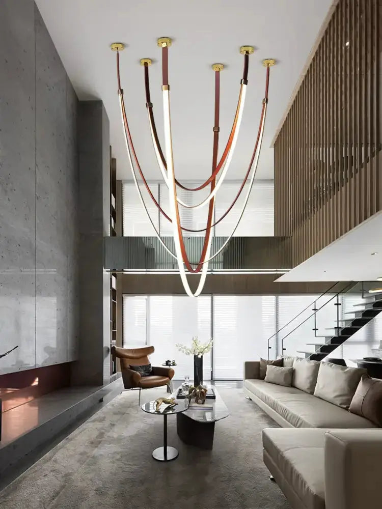 Chandelier Modern flexible leather belt LED pendant light Decorbites with brown straps in a modern living room on Tampa Home & Garden Store