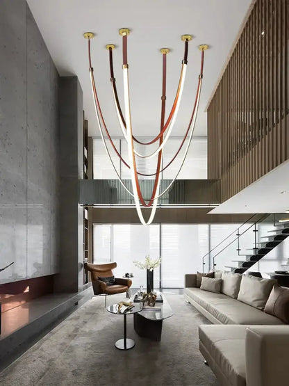 Chandelier flexible leather belt LED pendant in brown and cream by Decorbites living room on Tampa Home & Garden Store