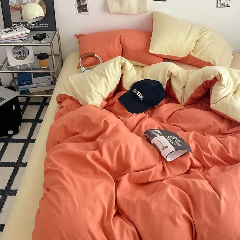 Cream Plush Quilt Set on a bed with peach quilt and cream sheets in a cozy bedroom on Tampa Home & Garden Store