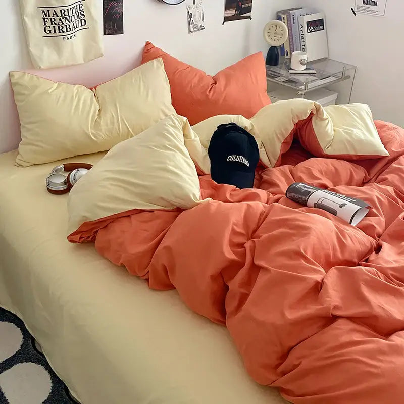 Cream Plush Quilt Set Decorbites on bed with coral orange duvet and cream pillows on Tampa Home & Garden Store
