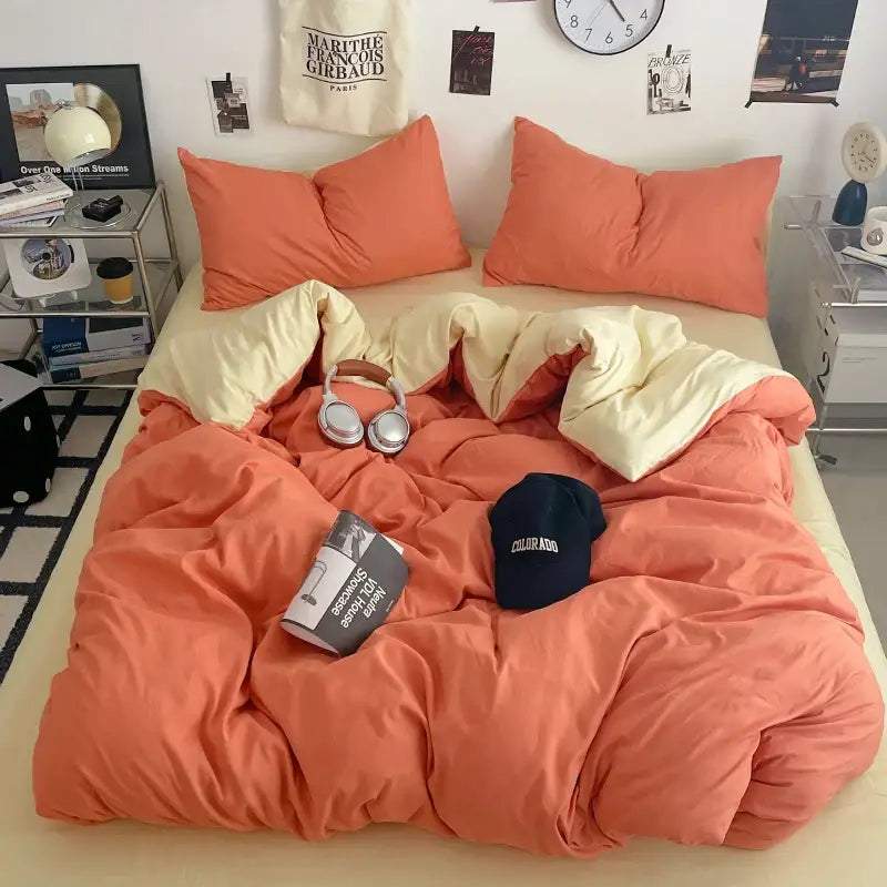 Cream plush quilt set with coral quilt visible on bed and coral pillows on Tampa Home & Garden Store
