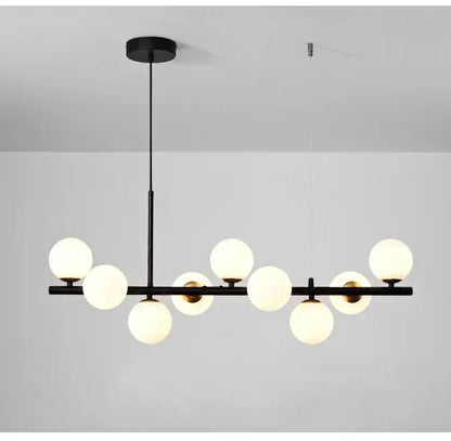 Black glass ceiling chandelier by Decorbites with a horizontal black bar and white globe bulbs on Tampa Home & Garden Store