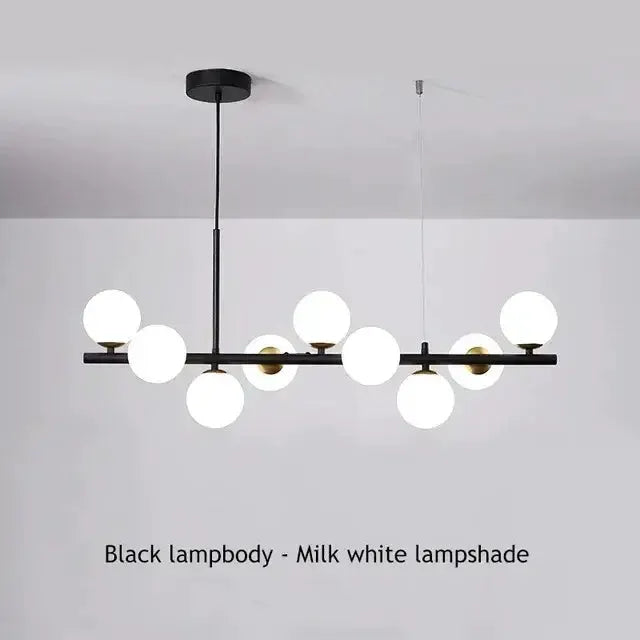 Decorbites modern chandelier with milk-white glass globes on a black metal bar with gold accents on Tampa Home & Garden Store