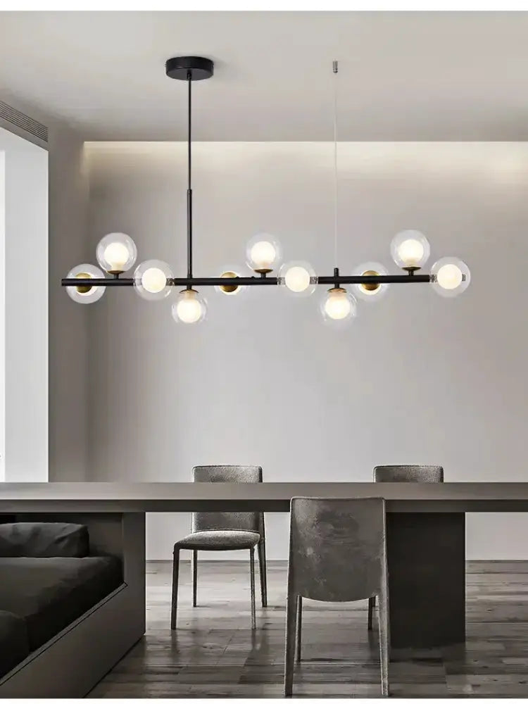 Chandelier modern gold glass globe pendant with black metal bar over dining table on Tampa Home & Garden Store