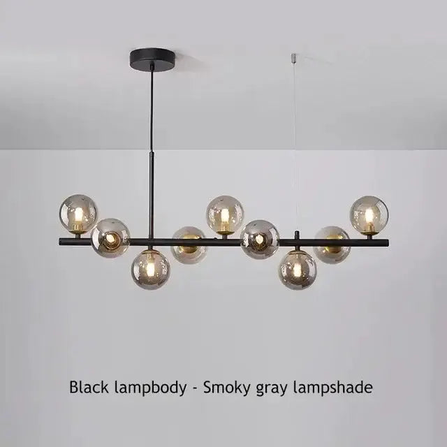 Chandelier Decorbites gold glass ball with amber globes on a black bar frame pendant light on Tampa Home & Garden Store