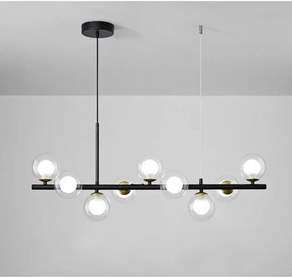 Chandelier modern black glass ball lighting on a linear bar with globe bulbs and brass accents on Tampa Home & Garden Store