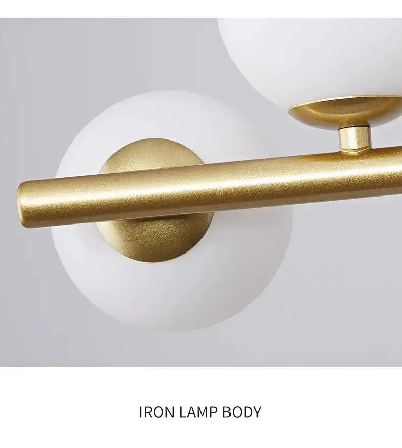 Chandelier with gold iron rod and white glass globes by Decorbites on Tampa Home & Garden Store