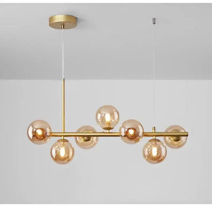 Chandelier Decorbites modern gold glass eight-globe pendant with brass bar and cognac globes on Tampa Home & Garden Store