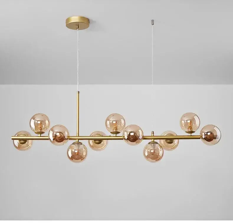 Chandelier modern gold glass ball pendant by Decorbites with cognac-tinted globes, dining room on Tampa Home & Garden Store