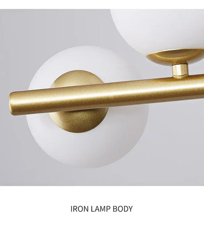 Brass Glass Ceiling Chandelier with a gold iron bar and two white glass globe shades on Tampa Home & Garden Store