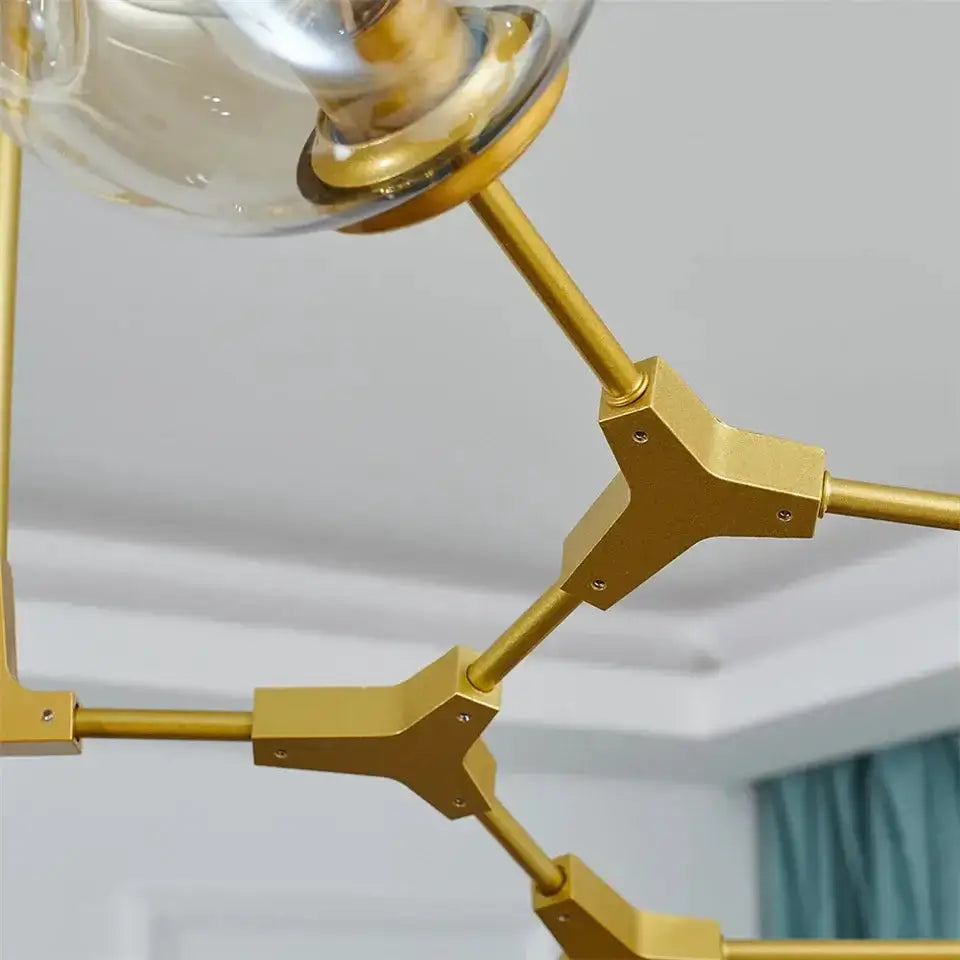 Nordic clear glass ball LED chandelier with gold finish and angular jointed arms on Tampa Home & Garden Store
