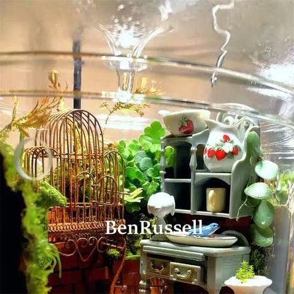 Decorbites glass moss terrarium vase with miniature gray furniture and a birdcage on Tampa Home & Garden Store