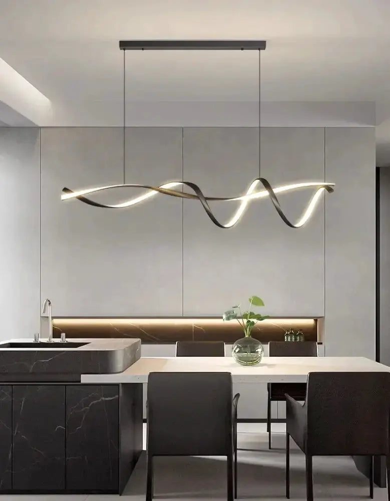 Modern black and gold wave LED glass pendant light chandelier over marble island Decorbites on Tampa Home & Garden Store
